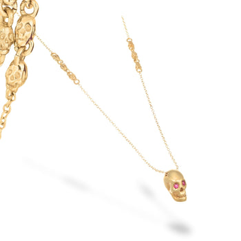 Smooth Yellow Skull Necklace With Red Stones