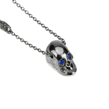Smooth Black Skull Necklace With Blue Stones