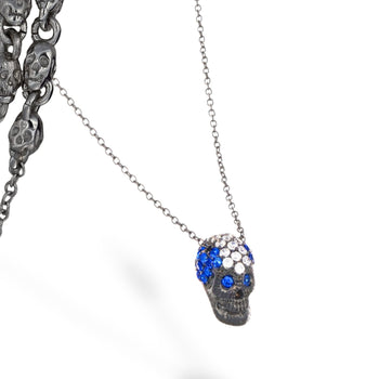 Black Pavé Skull Necklace With Blue/White Stones