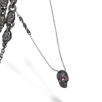 Smooth Black Skull Necklace With Pink Stones